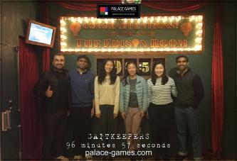Lab members pose underneath a sign that reads, Congratulations, you escaped the Edison Room.